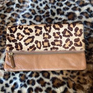 Super cute leather fold over pouch.